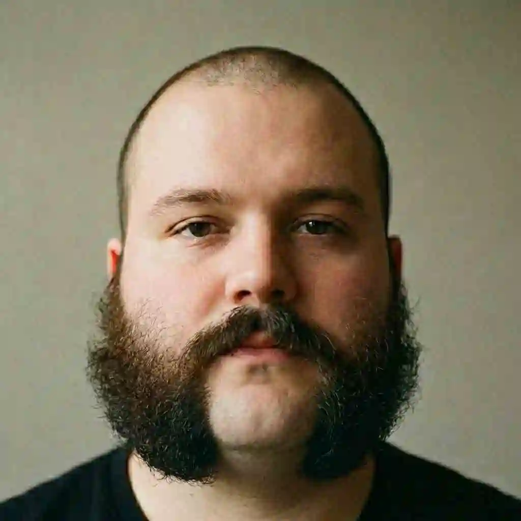 Example of mutton chops accentuating roundness and width which is considered a disastrous beard for your face shape if you have round facial features.