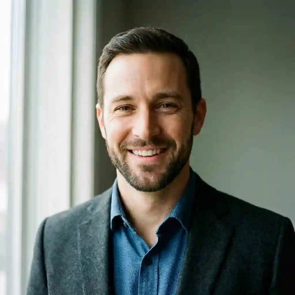 Man with an oval face wearing a Short Boxed Beard showing how a clean and well-defined beard for your face shape complements balanced features.