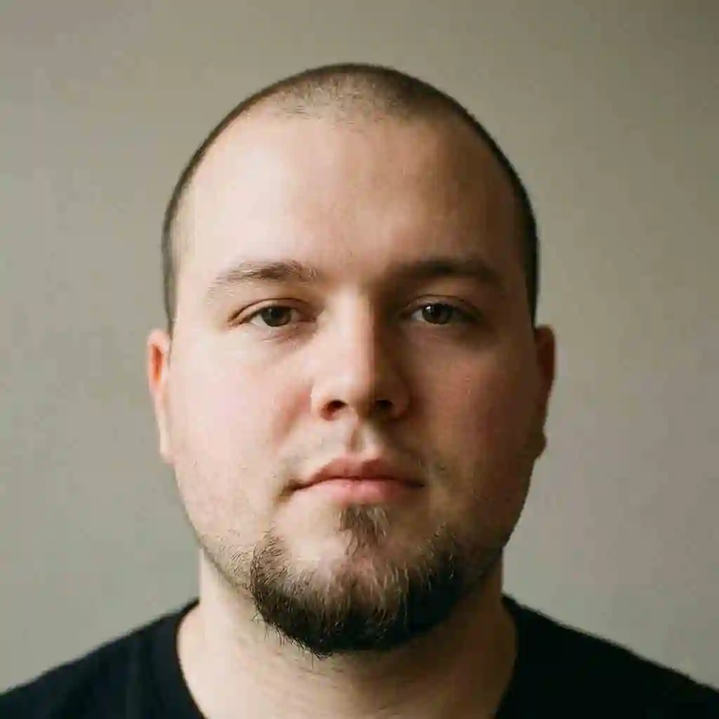 Man with a round face wearing a Goatee style which is an excellent best choice beard for your face shape to elongate the chin area.