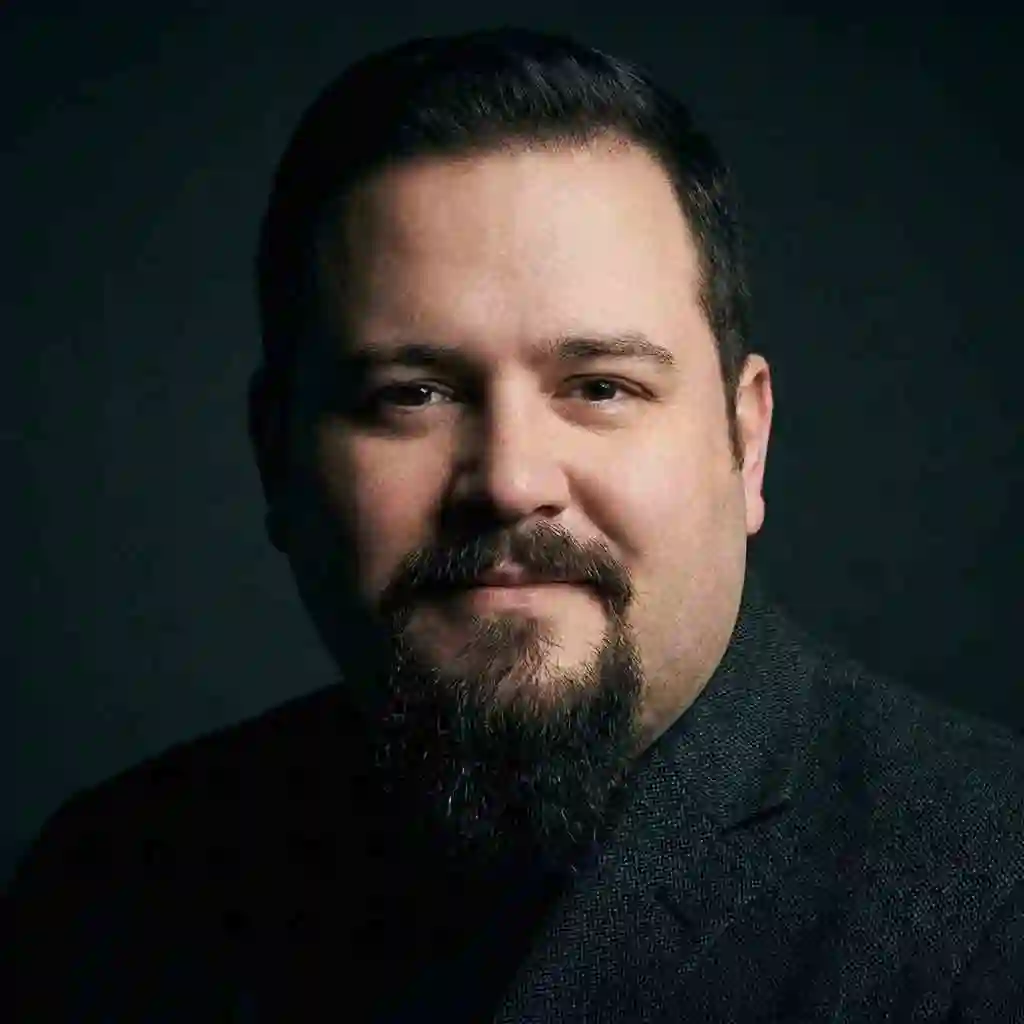 The Van Dyke style characterized by a disconnected mustache and goatee, serving as the best beard for your face shape to elongate round faces.