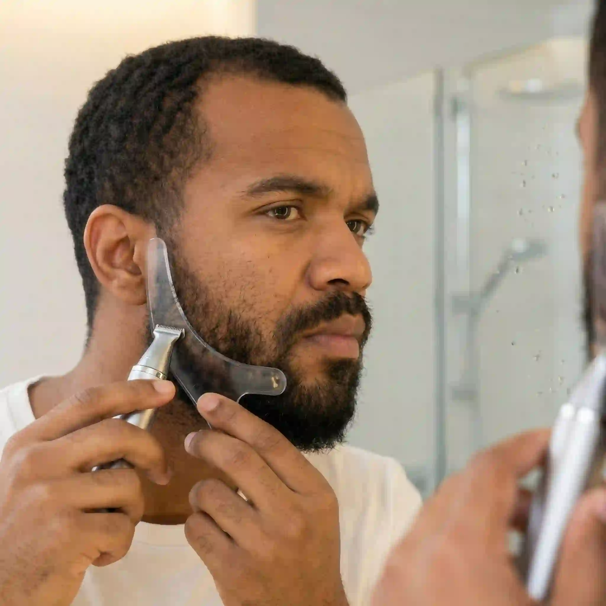 With your transparent beard liner tool positioned correctly against your face, simply shave away the stray hairs above the plastic edge to craft a remarkably sharp and well-defined cheek contour.