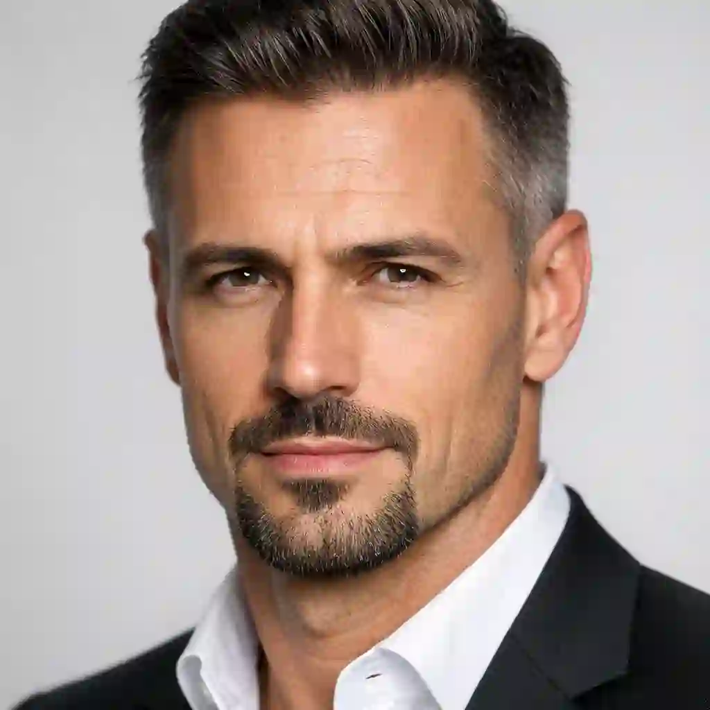 The intricate Balbo look shown on a man, a disconnected mustache, soul patch, and chin hair combination representing strategic beard styles ideal for masking patchy facial growth.