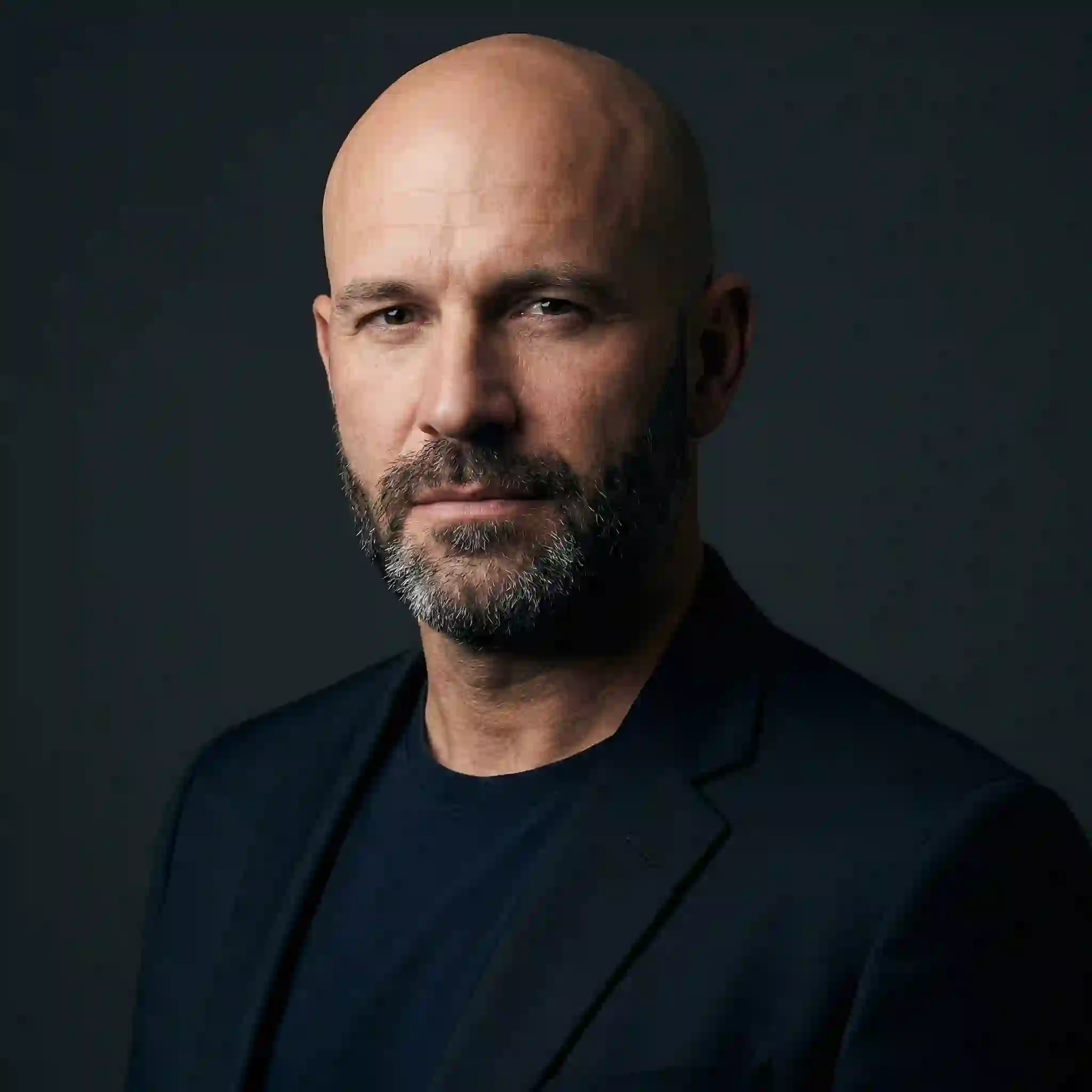 Best beard styles for bald men showing stubble and short boxed beard that balance facial features on a bald head